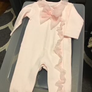 Pink onesie with feet attached